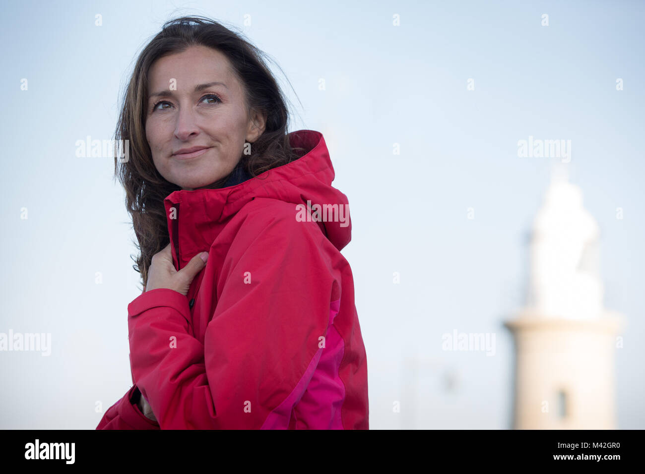 Mature female enjoying the outdoors in winter Stock Photo