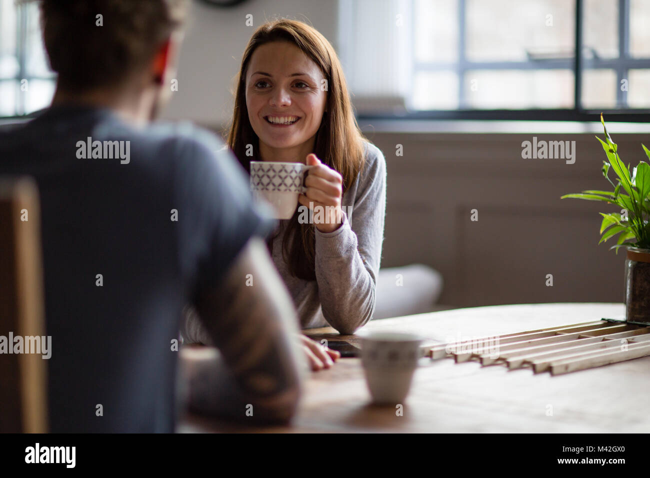 Young adult couple in a cafŽ together Stock Photo