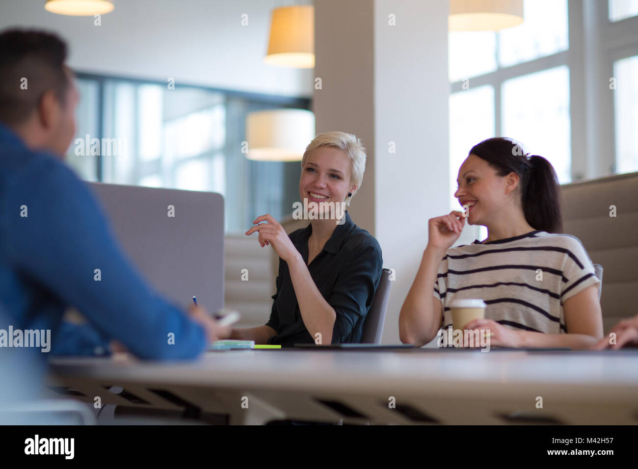 Business colleagues in a morning meeting with coffee Stock Photo