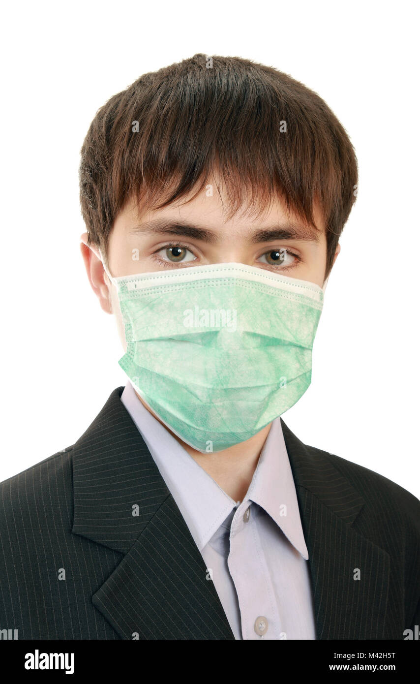 A teenager in a jacket with a protective medical mask on his face. Protection against viral infections Stock Photo