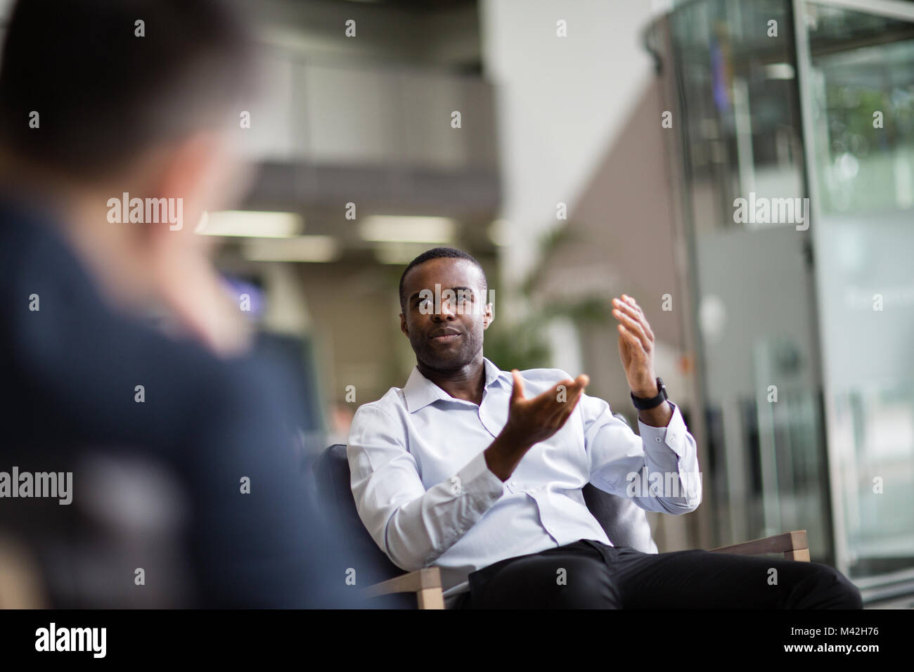 Businessman speaking in a meeting Stock Photo