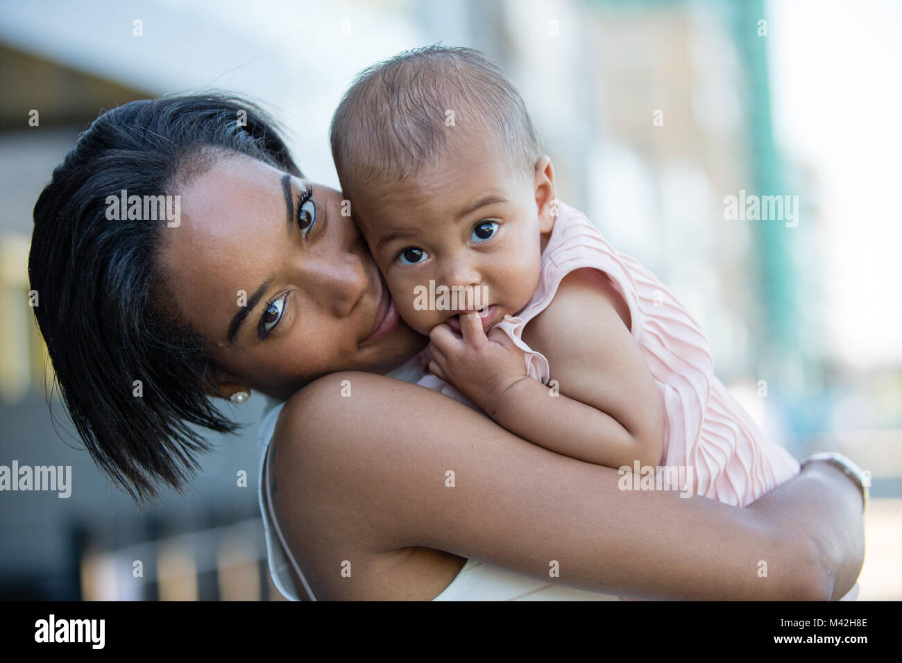 Mum and new baby in city Stock Photo