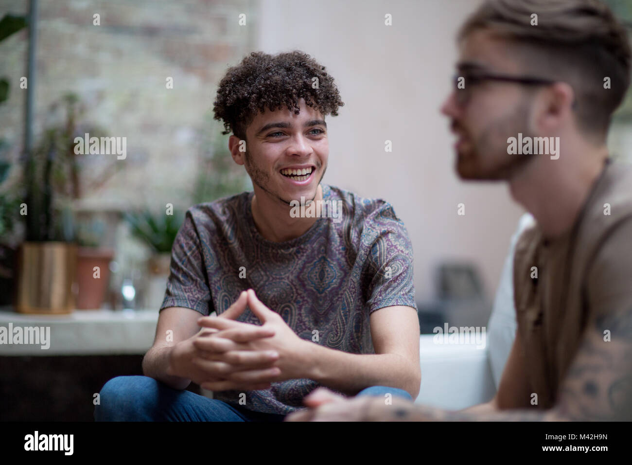 Young adult male with friend Stock Photo