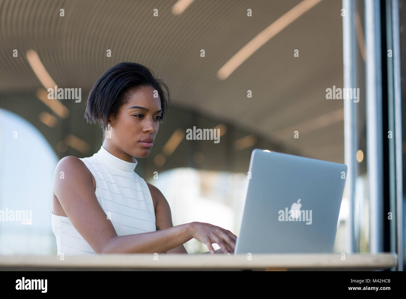 Businesswoman working in café Stock Photo