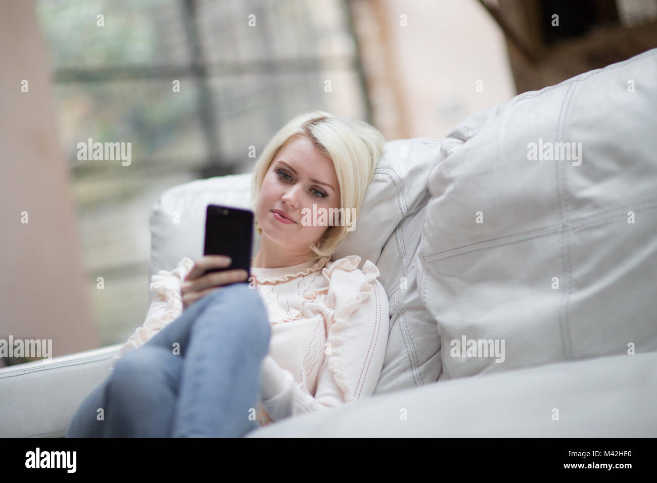 Young adult female on smartphone Stock Photo