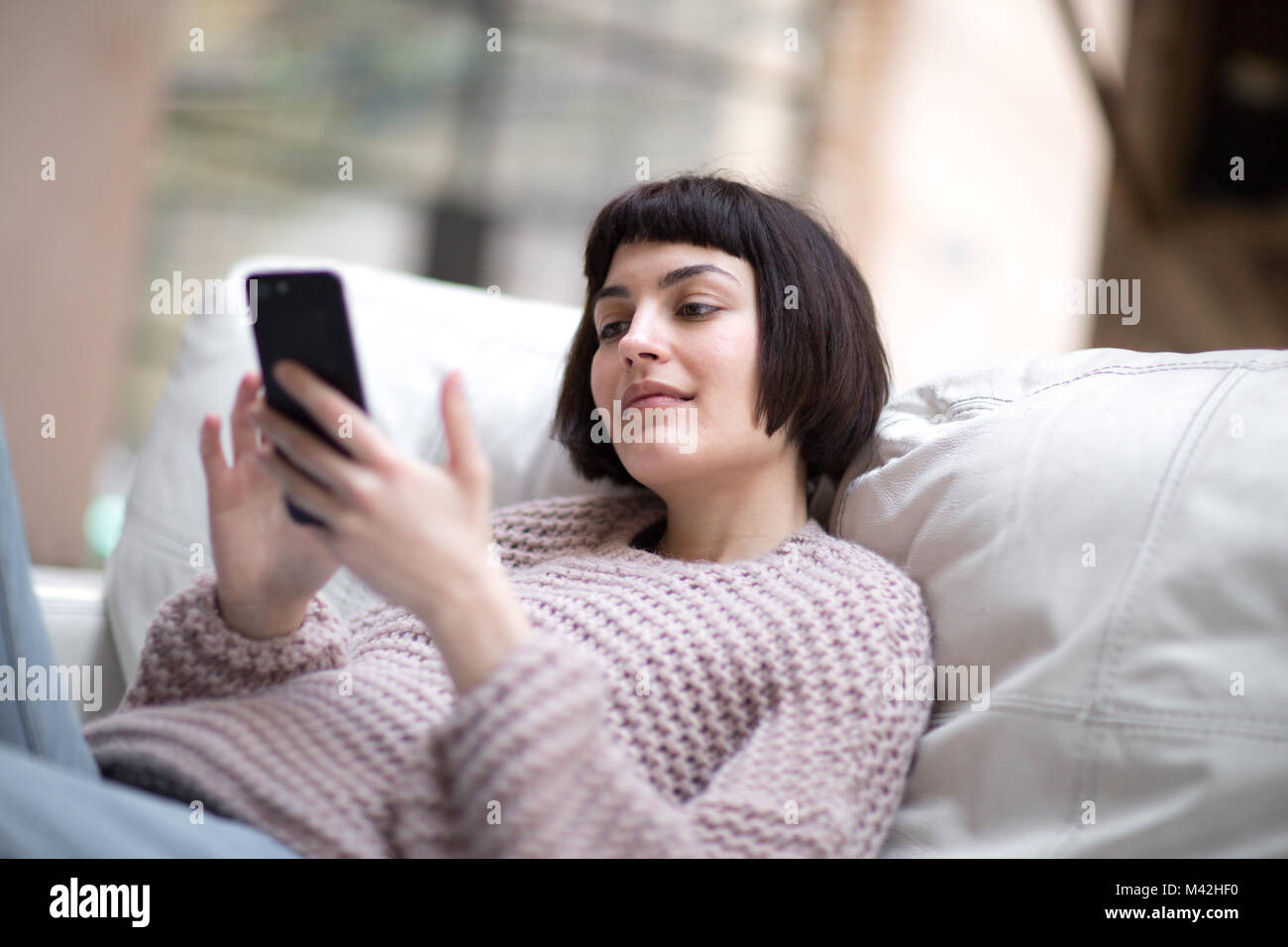 Young adult female on smartphone Stock Photo