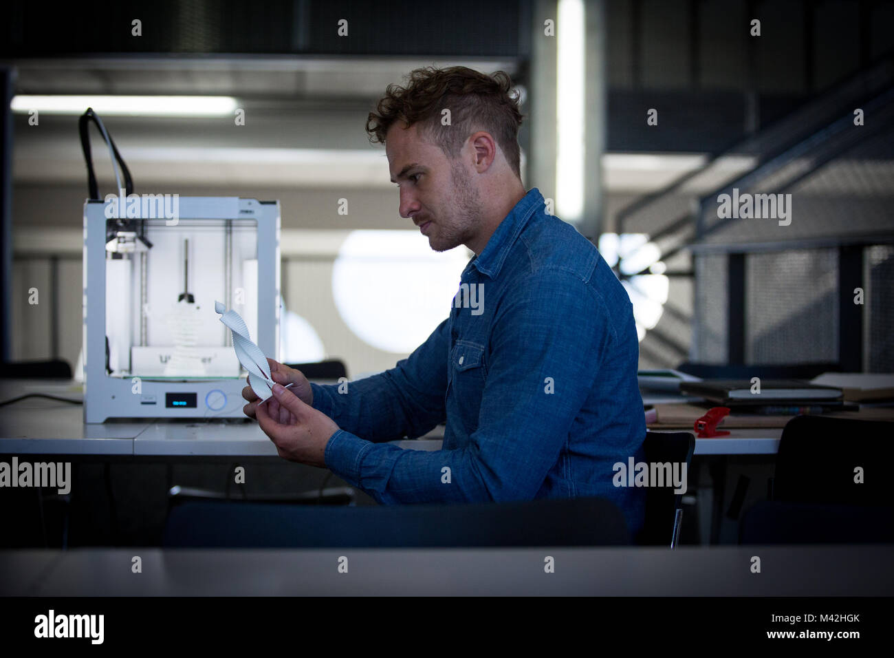 Designer with 3D printer Stock Photo