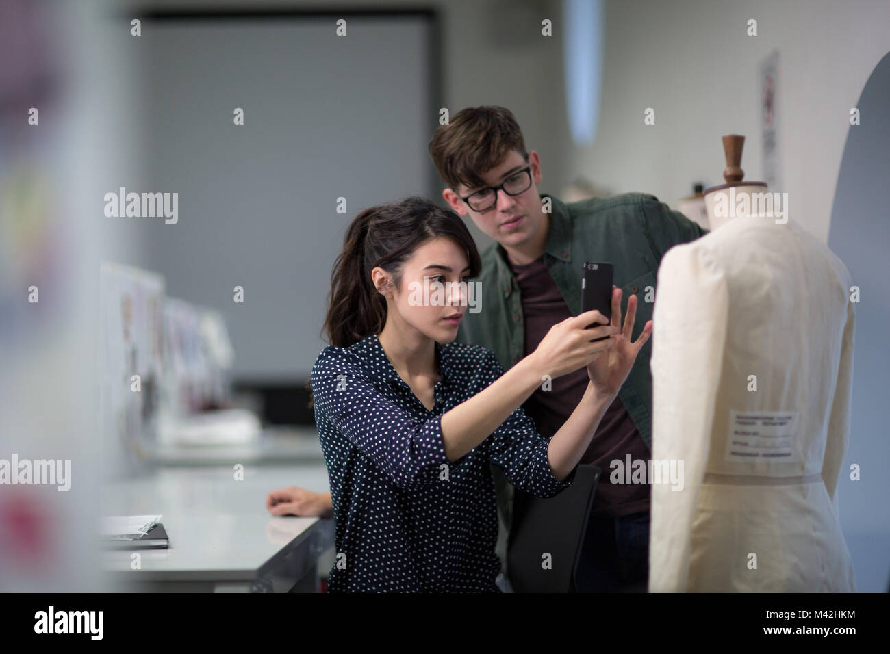 Fashion students taking a photo of a design Stock Photo