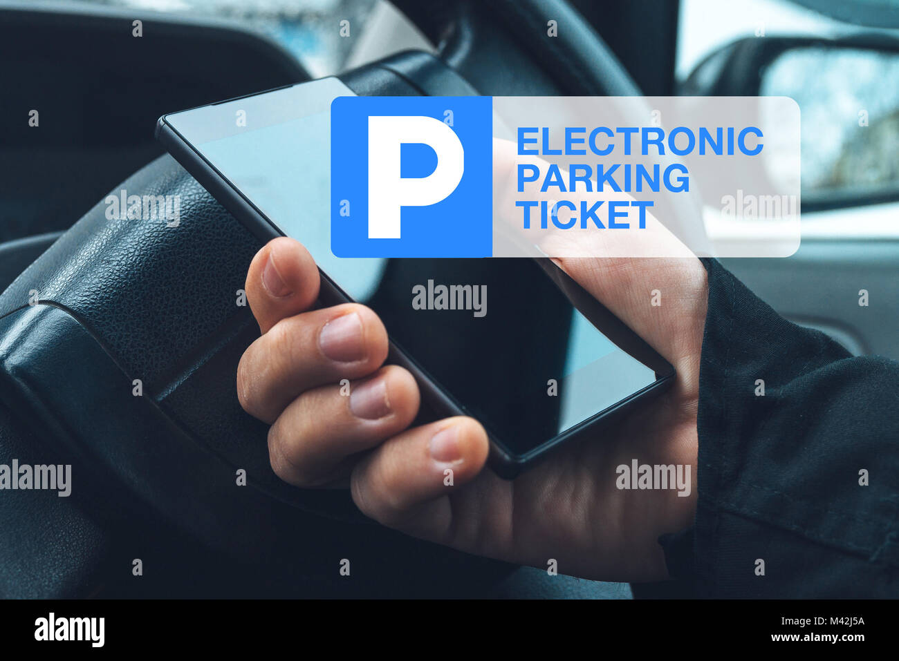 Electronic car parking ticket purchase with mobile smart phone app Stock Photo