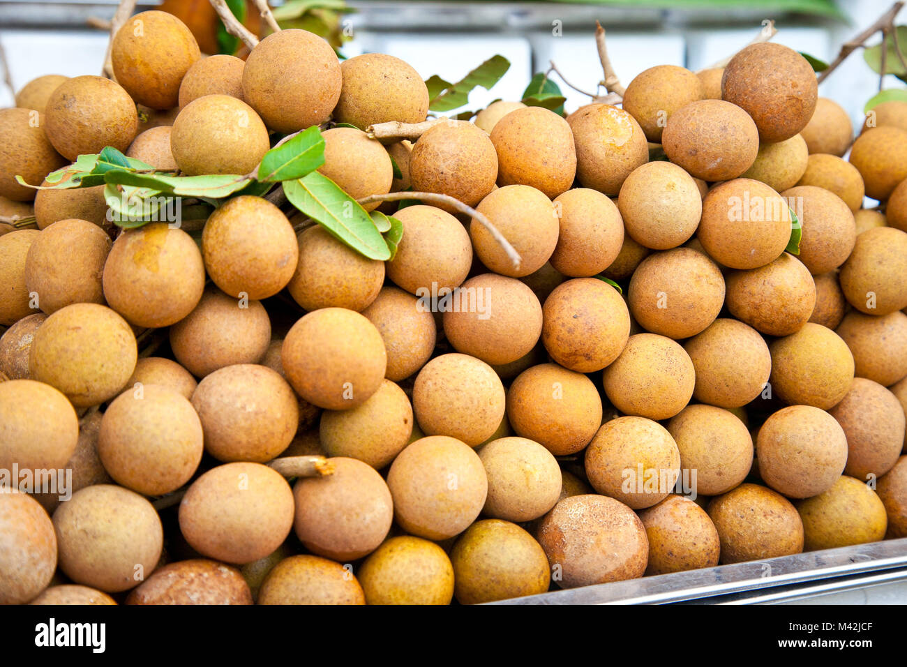 Longan fruit on the market in Saigon, Vietnam Stock Photo - Alamy