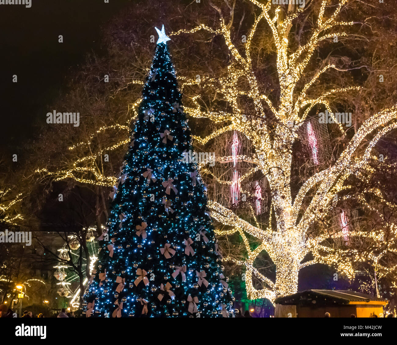 Colourful illuminated Christmas trees and decorations Winter Wonderland Christkindmarkt Rathausplatz Vienna