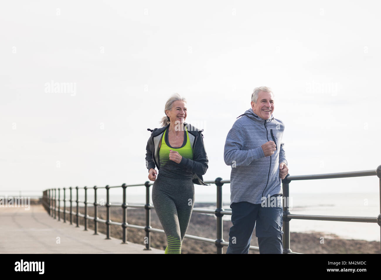 Senior couple jogging together Stock Photo
