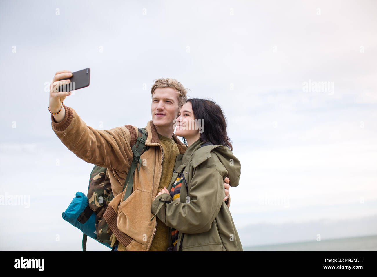Young couple taking a selfie on a camping trip Stock Photo