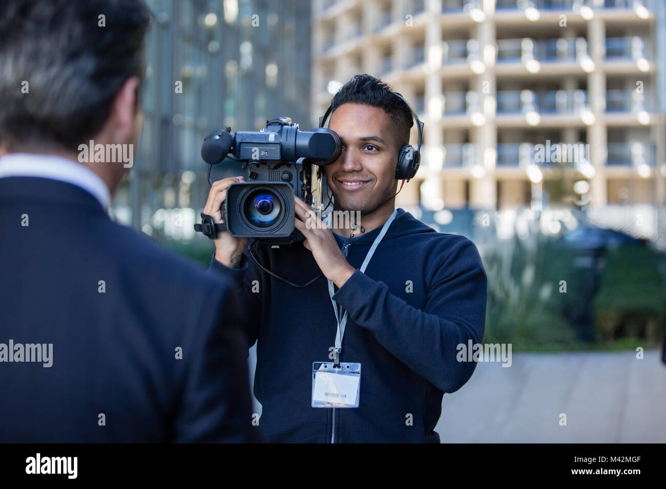 Cameraman filming for media broadcasting Stock Photo