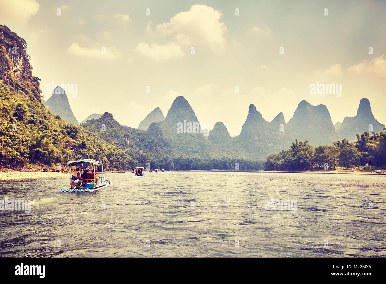 Retro toned picture of the Li River (Li Jiang) with bamboo rafts, China. Stock Photo