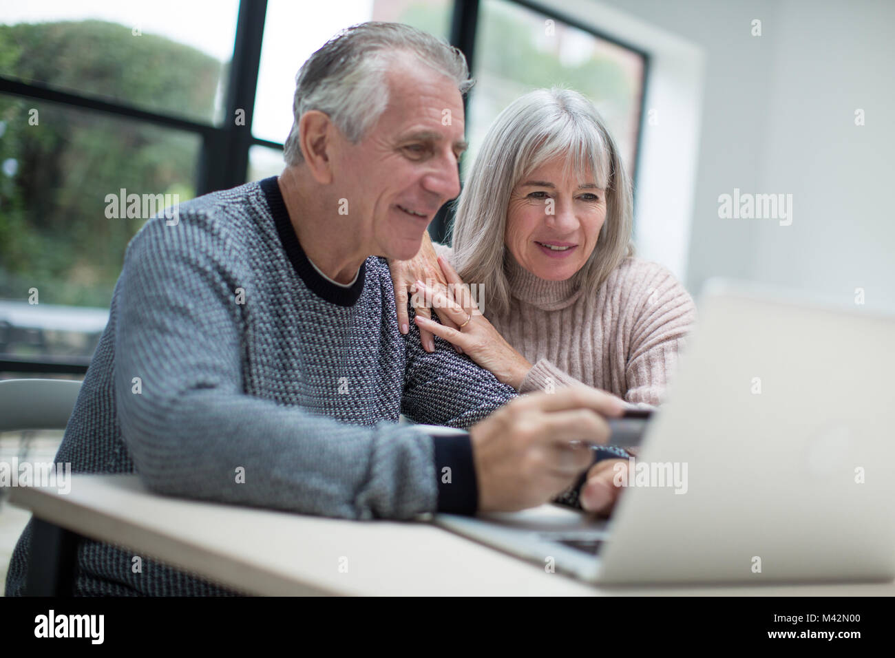 Senior couple online shopping Stock Photo