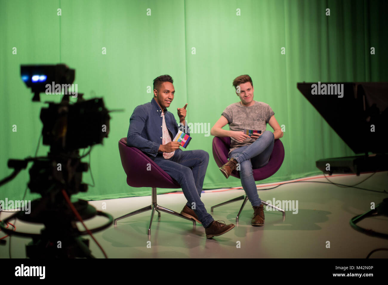 Presenters recording in a green screen studio Stock Photo