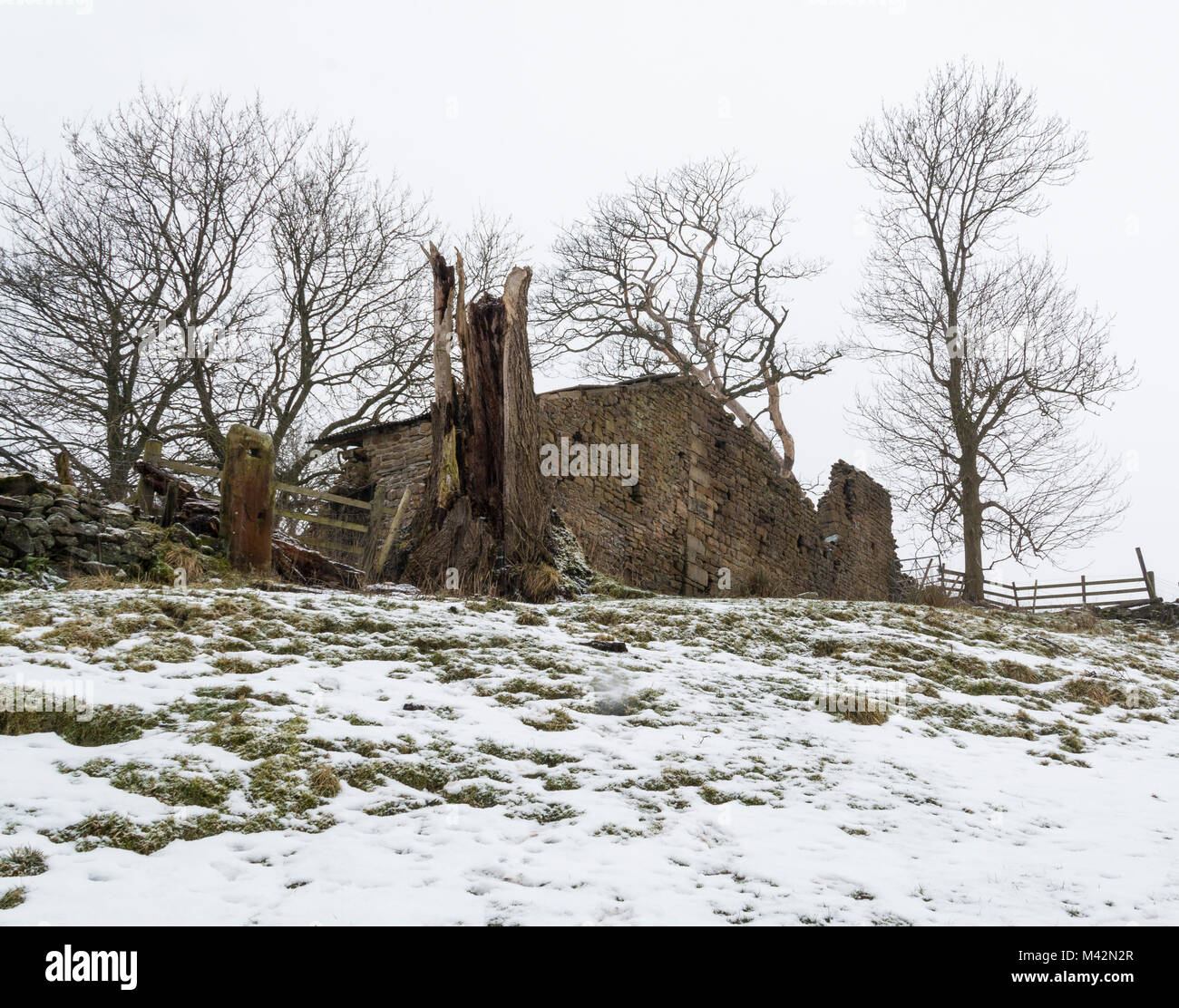 An image of a derelict building taken after a snow shower in Derbyshire, England, UK Stock Photo