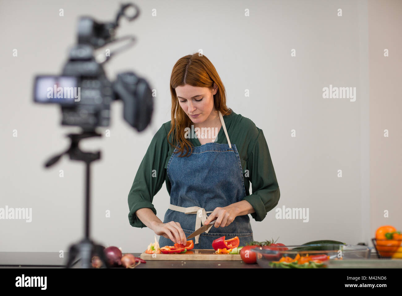 Adult female chef recording a video blog Stock Photo