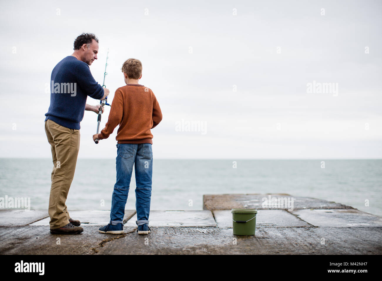 father-passing-son-fishing-rod-stock-photo-alamy