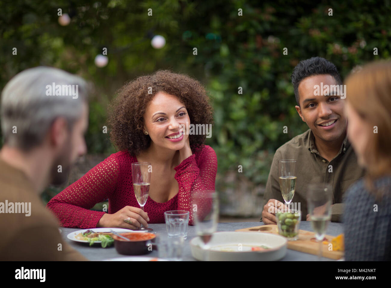 Friends eating a meal outdoors Stock Photo