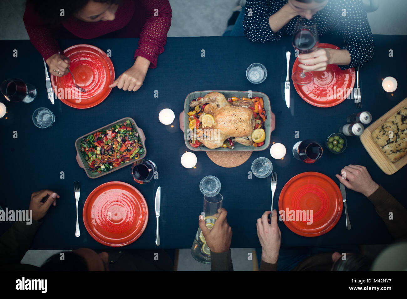 Overhead shot of group of friends having a meal Stock Photo
