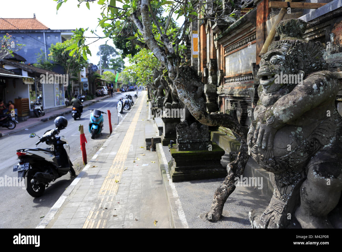 Balinese diety statues guard entrance of a local temple.Ubud.Bali.Indonesia Stock Photo
