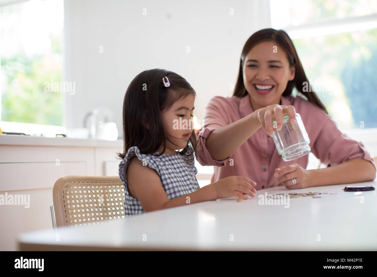 Girl counting her pocket money Stock Photo