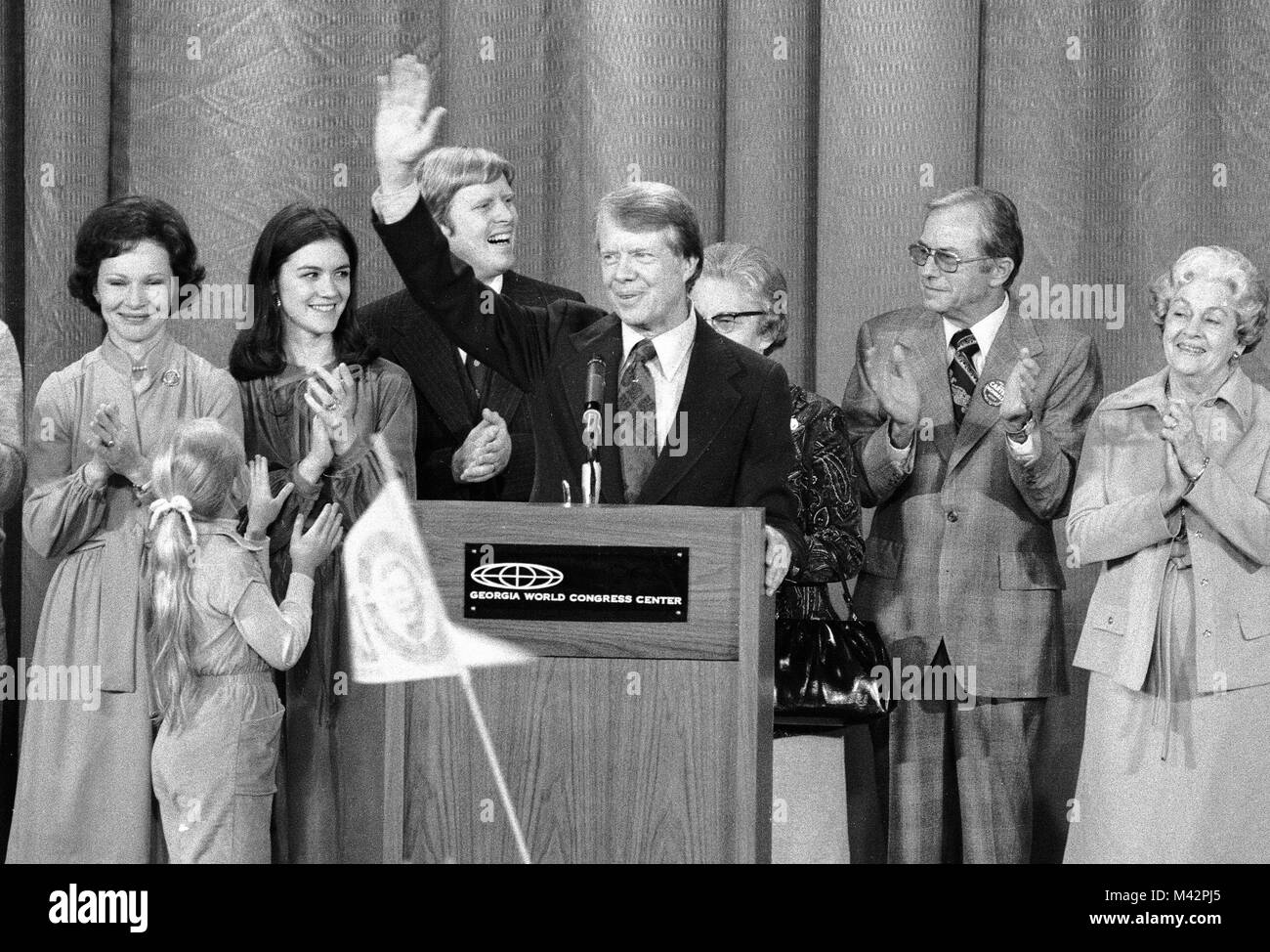 United States President-elect Jimmy Carter, surrounded by family, acknowledges the cheers of the crowd at an election night rally as he claims victory over US President Gerald R. Ford in Atlanta, Georgia on November 3, 1976.   Credit: Benjamin E. 'Gene' Forte / CNP /MediaPunch Stock Photo