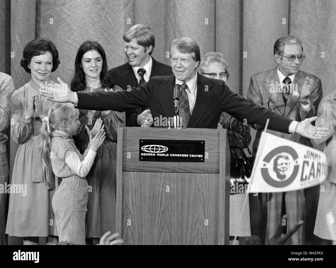 United States President-elect Jimmy Carter, surrounded by family, acknowledges the cheers of the crowd at an election night rally as he claims victory over US President Gerald R. Ford in Atlanta, Georgia on November 3, 1976.   Credit: Benjamin E. 'Gene' Forte / CNP /MediaPunch Stock Photo
