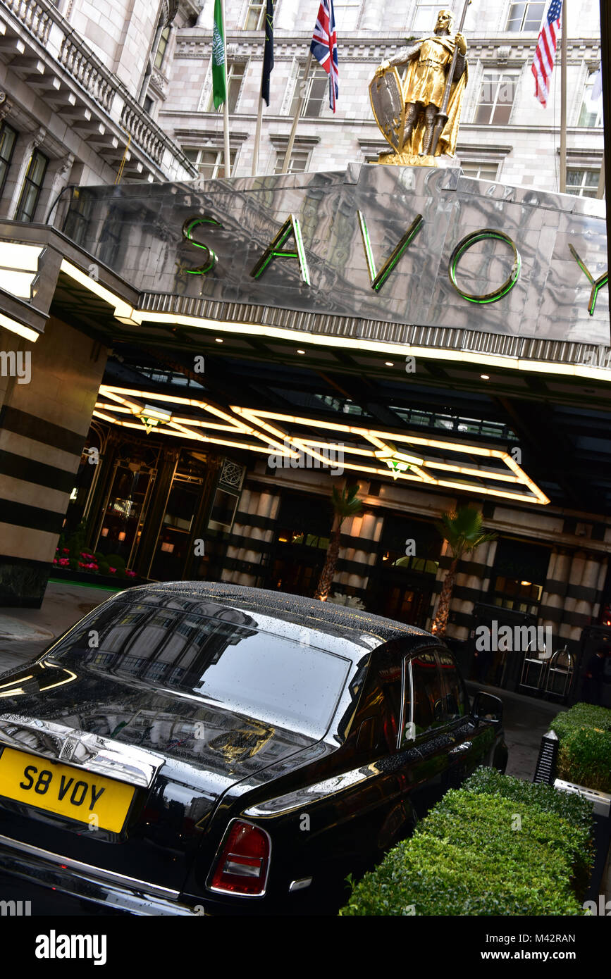 A privately registered Bentley car outside of the savoy in the strand
