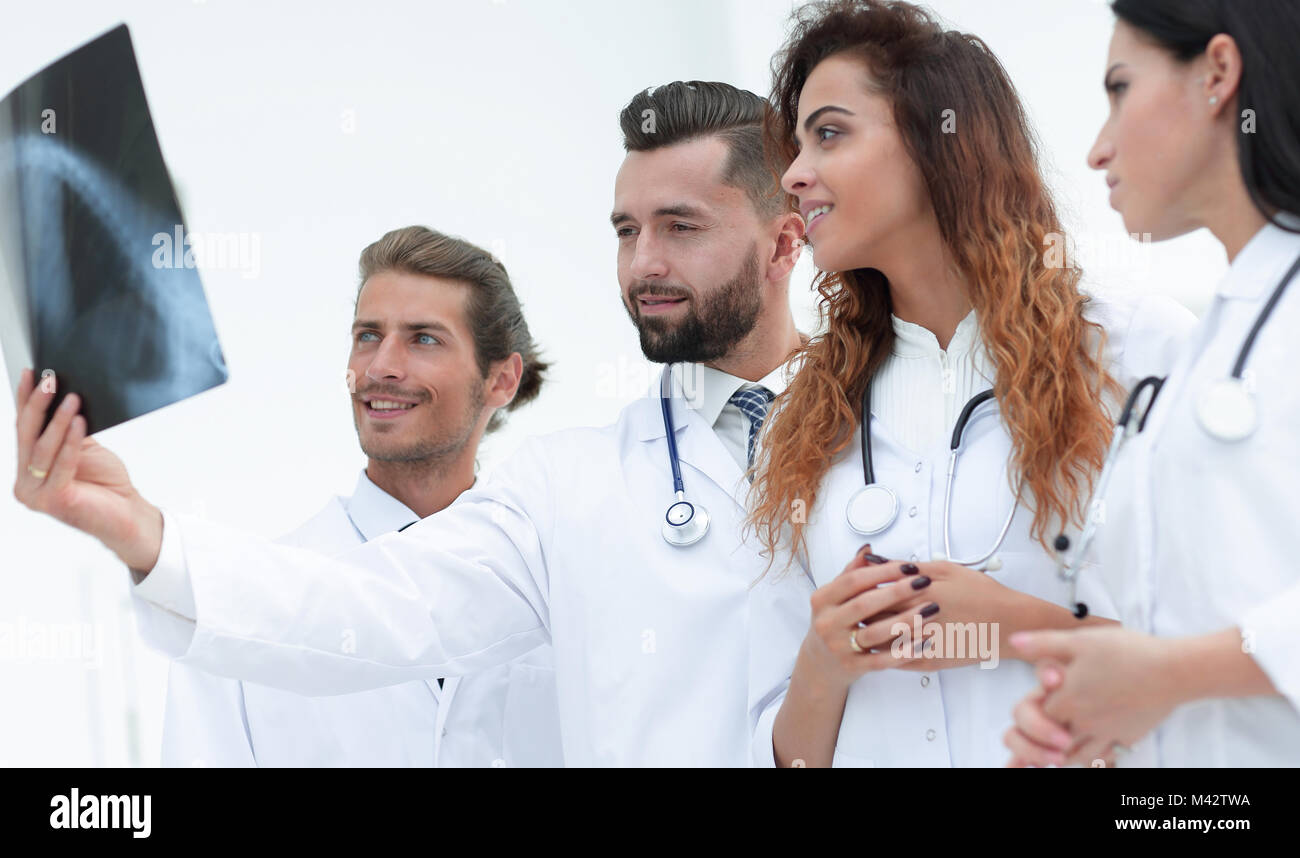 Portrait of young male doctors looking at x-ray Stock Photo - Alamy