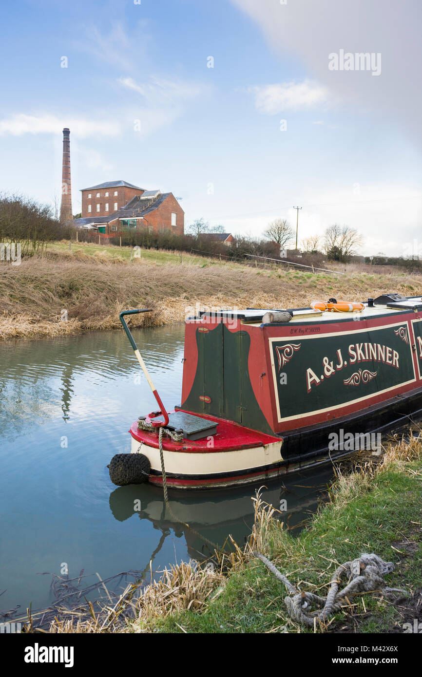 Narrowboat (narrow boat)on the Kennet and Avon Canal with the Crofton Pumping Station (Crofton Beam Engines) in the background, Wiltshire, England, UK Stock Photo