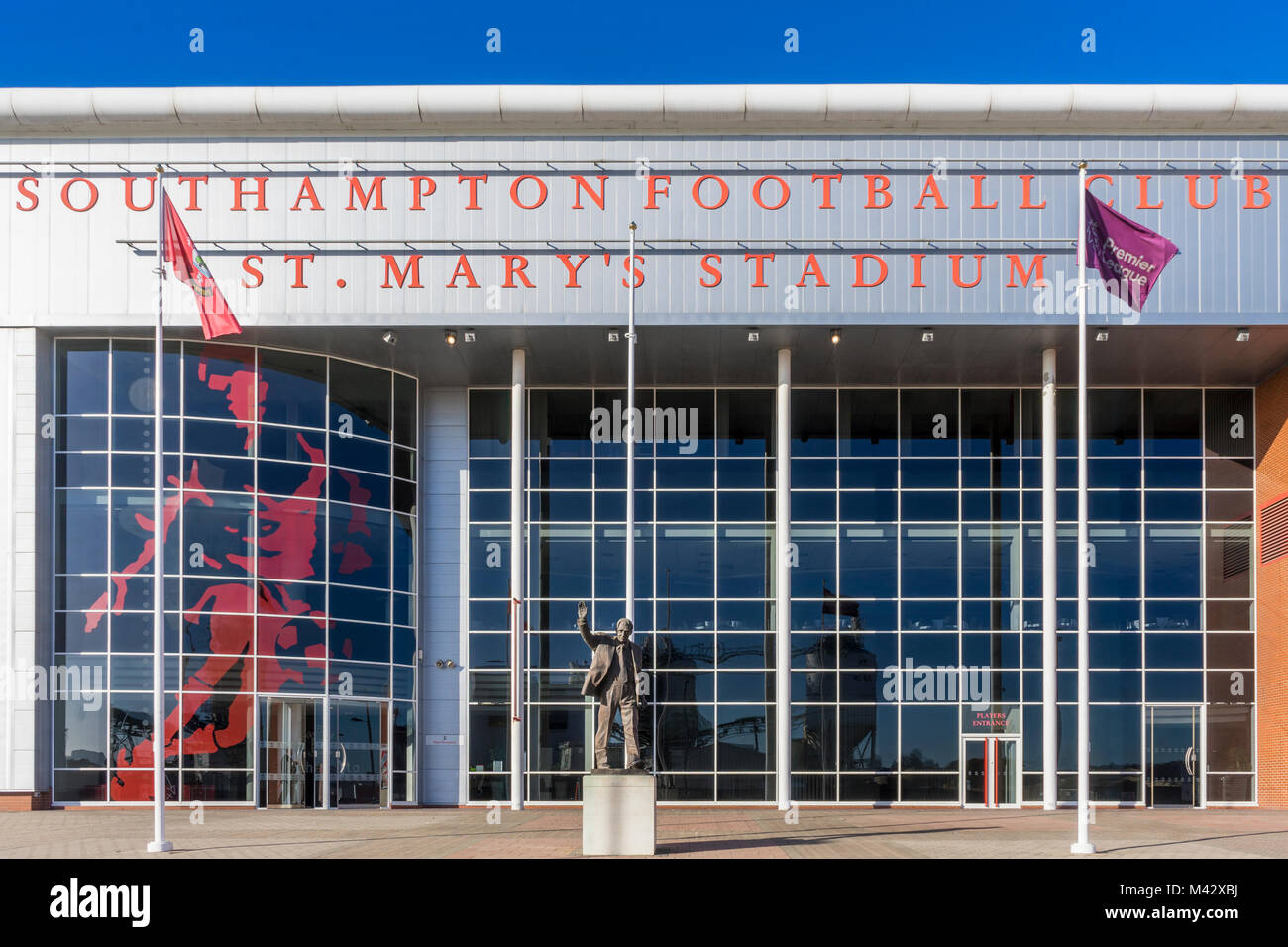 Front facade of St. Mary's football stadium home to Southampton Football Club with the Ted Bates statue in the foreground, Southampton, England, UK Stock Photo