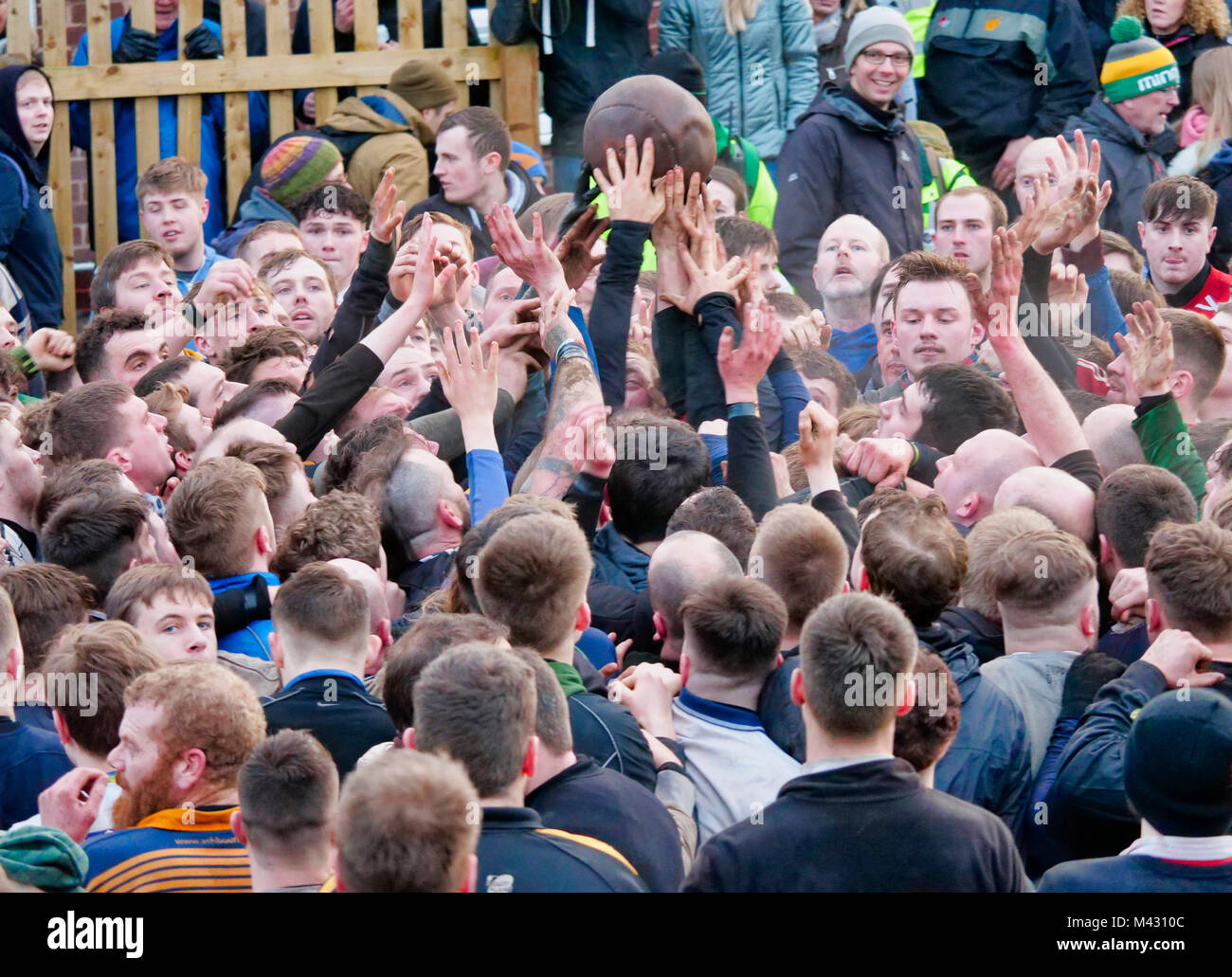 Ashbourne, UK. 13th February 2018. Ye Olde & Ancient Medieval hugball game is the forerunner to football. It's played between two teams, the Up'Ards & Down'Ards separated by the Henmore Brook river. The goals are 3 miles apart at Sturston Mill & Clifton Mill. Charles Cotton's poem Burlesque upon the Great Frost, dating from 1683, mentions this game at Ashbourne. He was the cousin of Aston Cockayne Baronet of Ashbourne, Derbyshire. Credit: Doug Blane/Alamy Live News Stock Photo