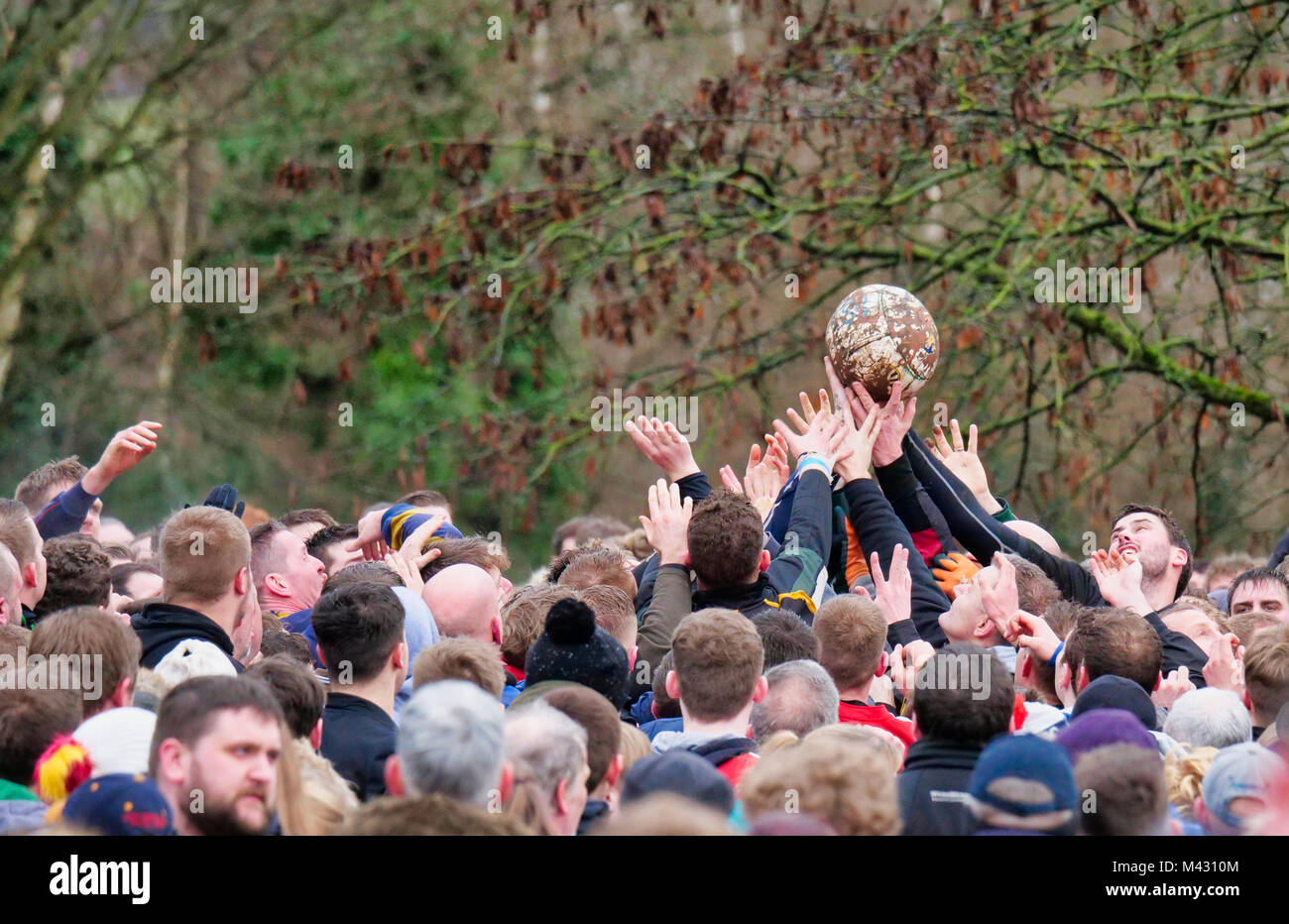 Ashbourne, UK. 13th February 2018. Ye Olde & Ancient Medieval hugball game is the forerunner to football. It's played between two teams, the Up'Ards & Down'Ards separated by the Henmore Brook river. The goals are 3 miles apart at Sturston Mill & Clifton Mill. Charles Cotton's poem Burlesque upon the Great Frost, dating from 1683, mentions this game at Ashbourne. He was the cousin of Aston Cockayne Baronet of Ashbourne, Derbyshire. Credit: Doug Blane/Alamy Live News Stock Photo