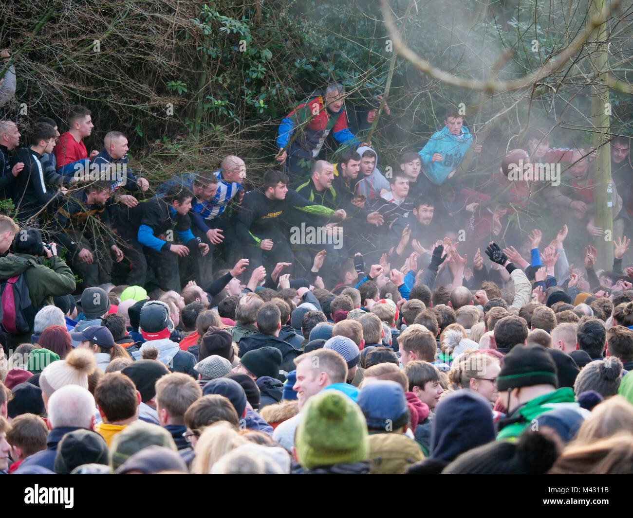 Ashbourne, UK. 13th February 2018. Ye Olde & Ancient Medieval hugball game is the forerunner to football. It's played between two teams, the Up'Ards & Down'Ards separated by the Henmore Brook river. The goals are 3 miles apart at Sturston Mill & Clifton Mill. Charles Cotton's poem Burlesque upon the Great Frost, dating from 1683, mentions this game at Ashbourne. He was the cousin of Aston Cockayne Baronet of Ashbourne, Derbyshire. Credit: Doug Blane/Alamy Live News Stock Photo