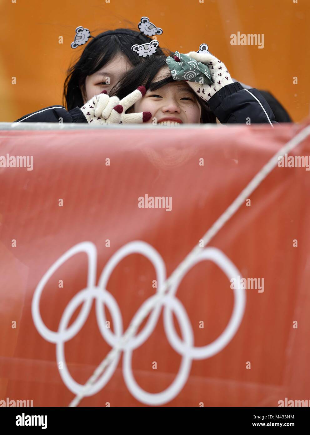 Pyeongchang, South Korea. 14th February, 2018. A few hardy souls braved the windy weather. Womens Slalom. Alpine Skiing. Yongpyong alpine centre. Pyeongchang2018 winter Olympics. Alpensia. Republic of Korea. 14/02/2018. Credit: Sport In Pictures/Alamy Live News Stock Photo