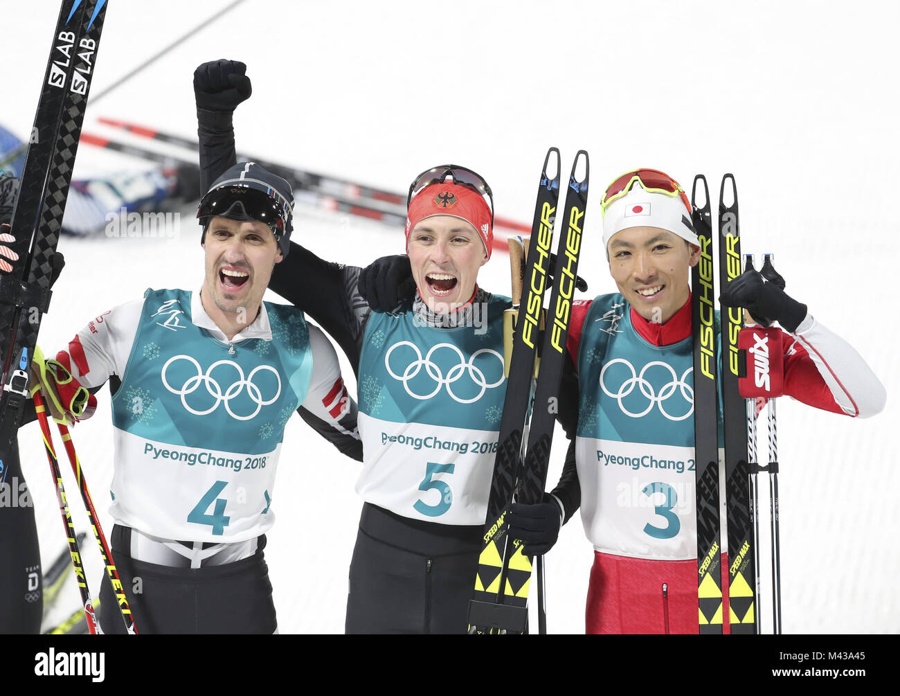Pyeongchang, South Korea. 14th Feb, 2018. Gold medalist Eric Frenzel (C) from Germany, silver medalist Akito Watabe (R) from Japan and Lukas Klapfer from Austria pose for photos after finishing individual gundersen NH/10KM event of Nordic Combined at 2018 PyeongChang Winter Olympic Games at Alpensia Biathlon Centre, PyeongChang, Feb. 14, 2018. Credit: Bai Xuefei/Xinhua/Alamy Live News Stock Photo