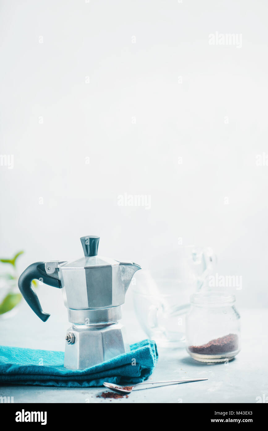 Brewing coffee in Moka pot concept. Morning routine photography with copy space. Stock Photo