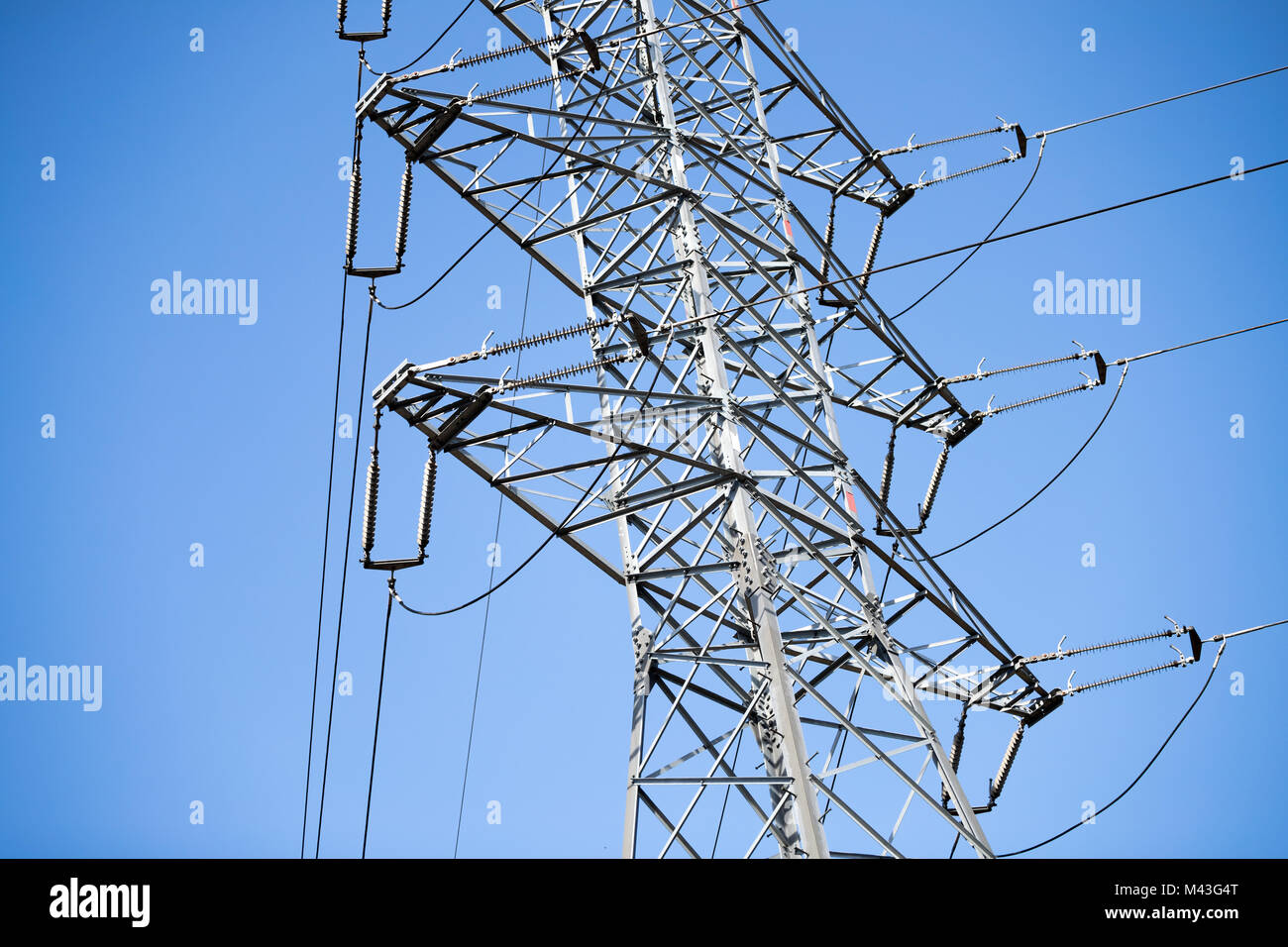 Picture of transmission line tower on blue sky Stock Photo