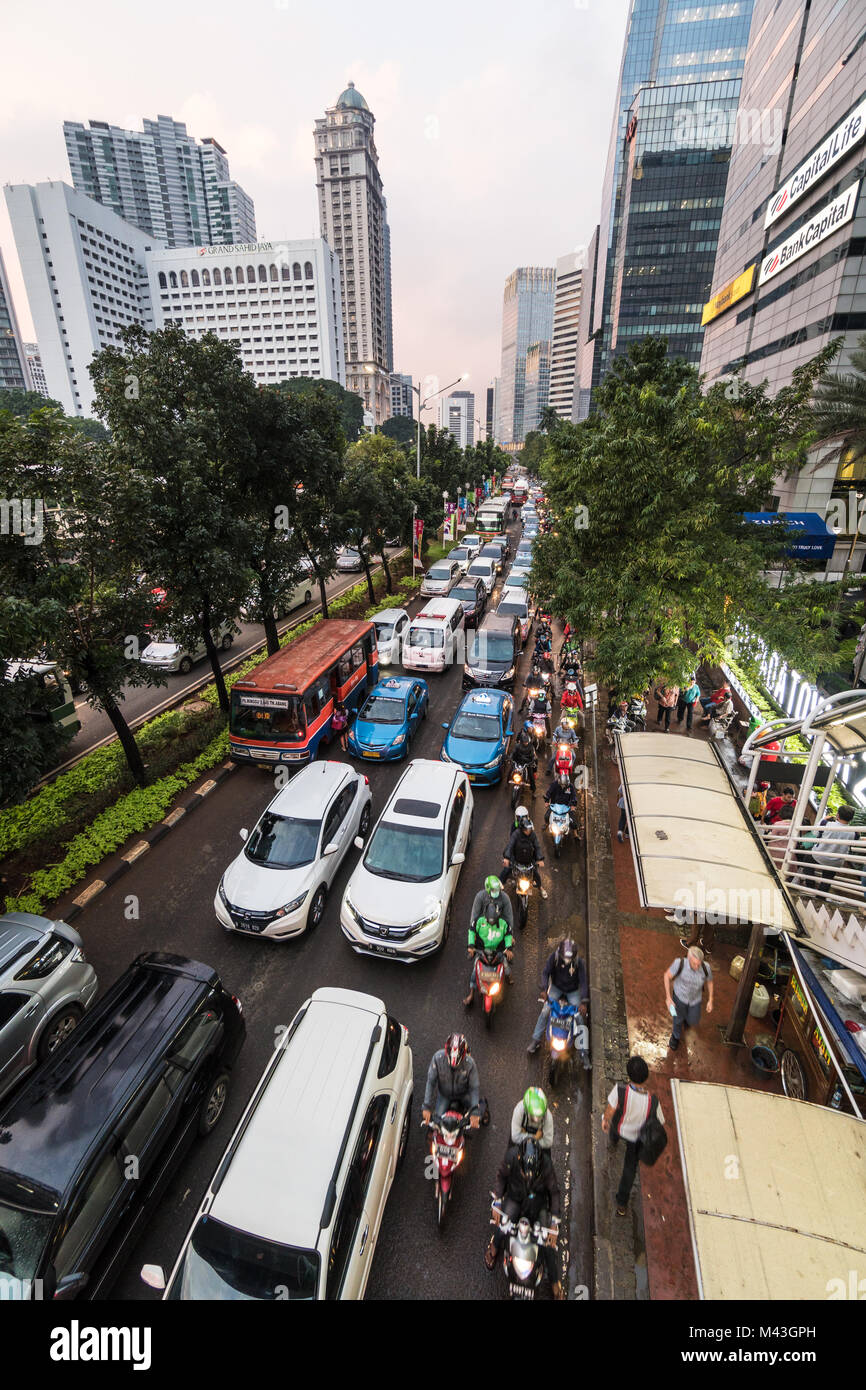 Jakarta, Indonesia - February 9 2018: Cars, buses and motorcycles stuck in a traffic jam on Sudirman street in Jakarta business district in Indonesia  Stock Photo