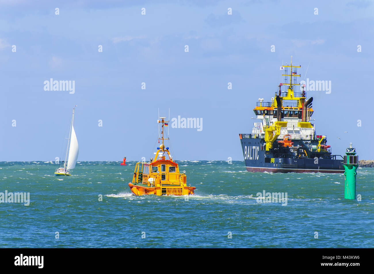 Ocean-going tugs, pilot boat and yacht harbor in R Stock Photo