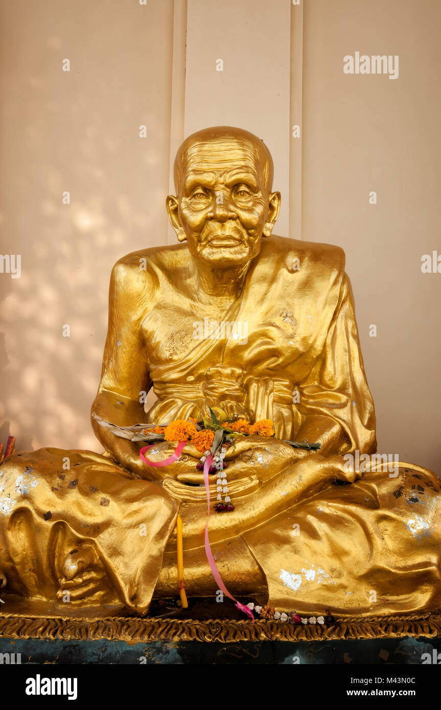 Gold buddhist monk statue in temple Stock Photo Alamy