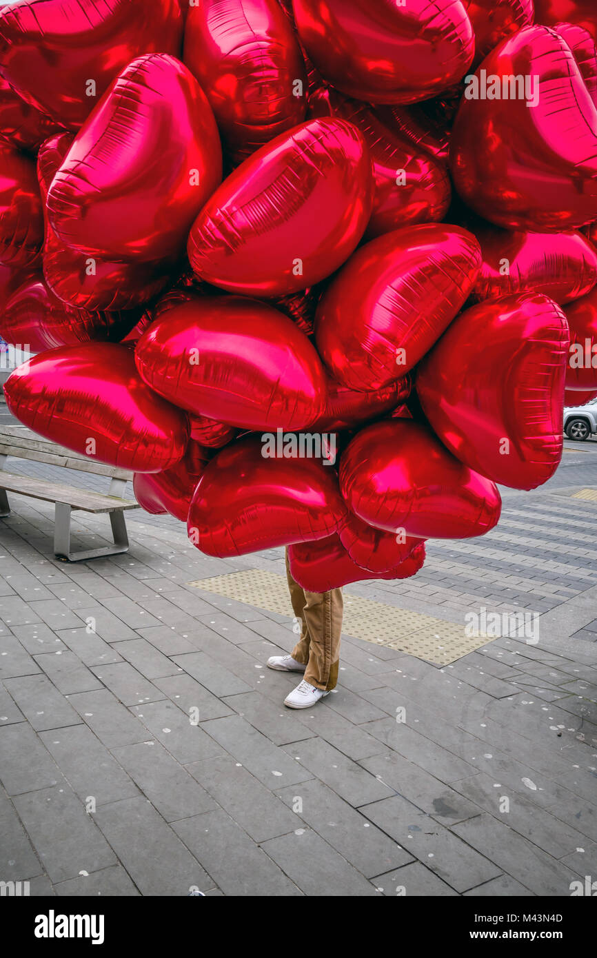 A Man Selling Red Heart Balloons On Valentine S Day In Central Stock Photo Alamy