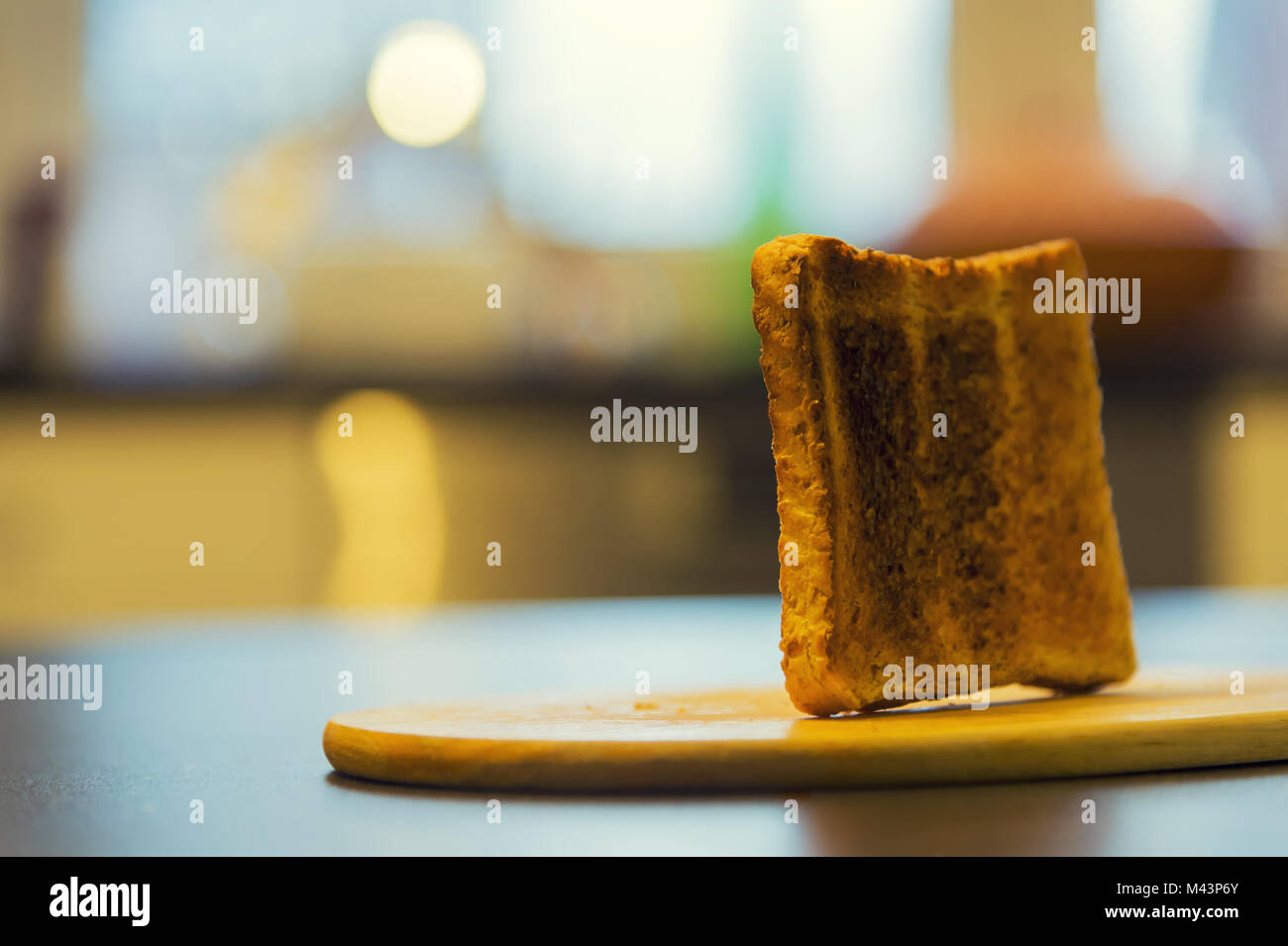 A slice of toast stands on a breakfast tray Stock Photo