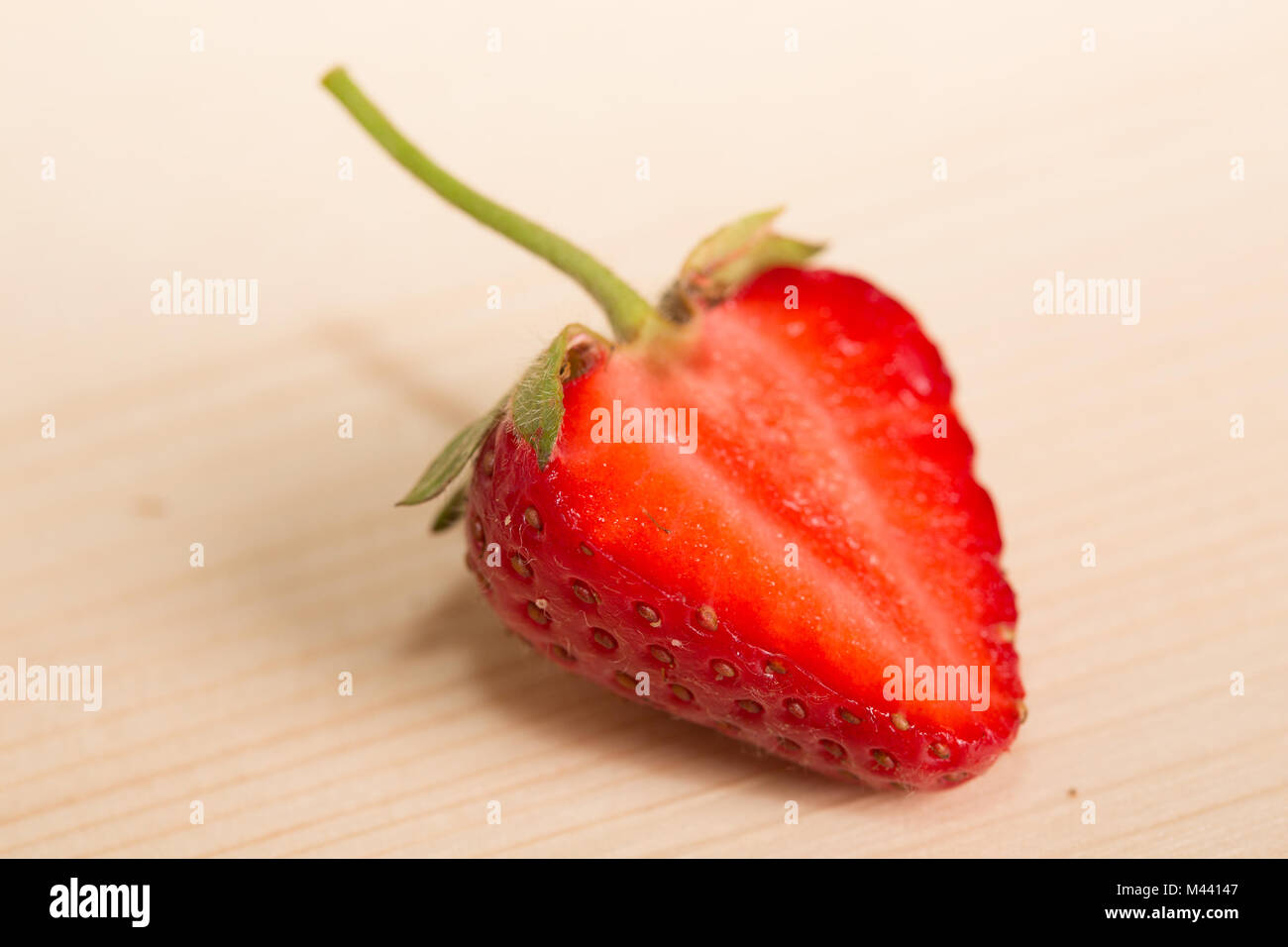 Fresh, juicy strawberries on a wood table Stock Photo - Alamy