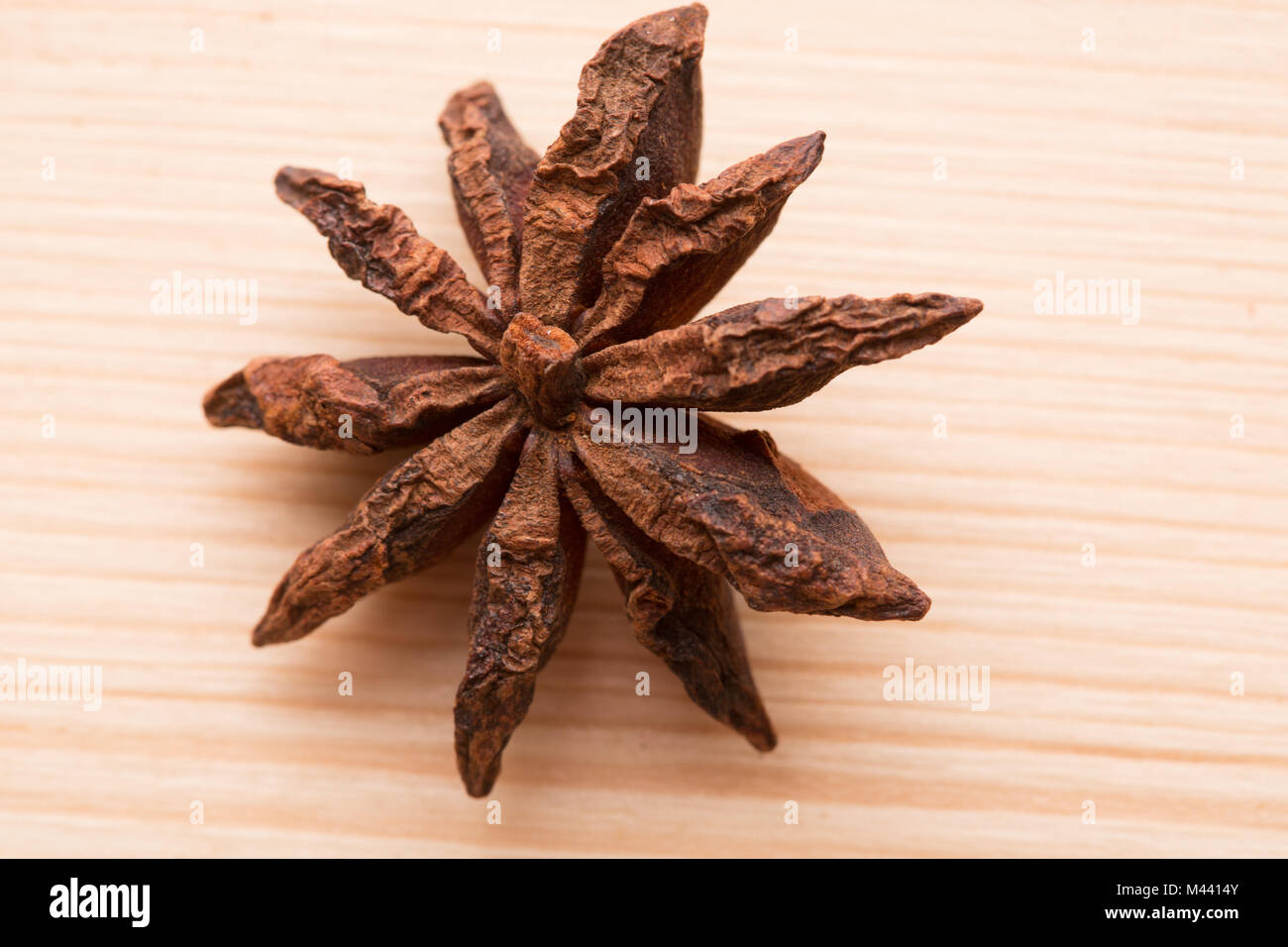 Organic star anise on a wooden table Stock Photo