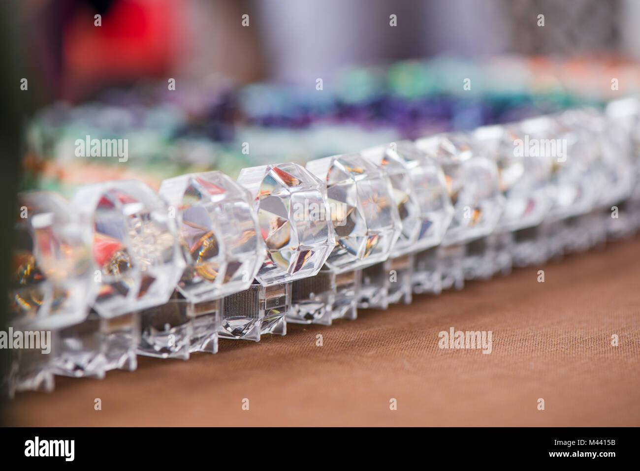 Engagement ring boxes in a row on colorful background Stock Photo - Alamy