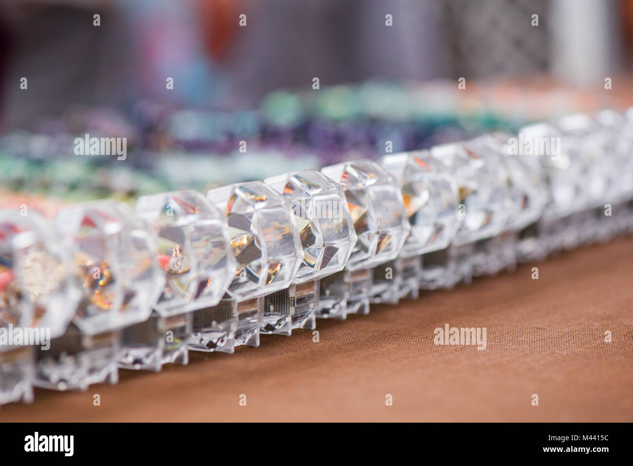 Engagement ring boxes in a row on colorful background Stock Photo - Alamy